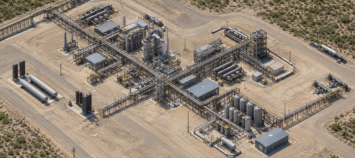 Aerial view of an Infinium fuel production facility laid out across the West Texas desert, with reactors, pipe racks and storage vessels